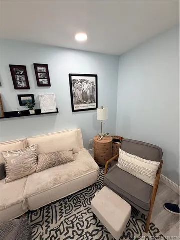 a living room with furniture and a chair