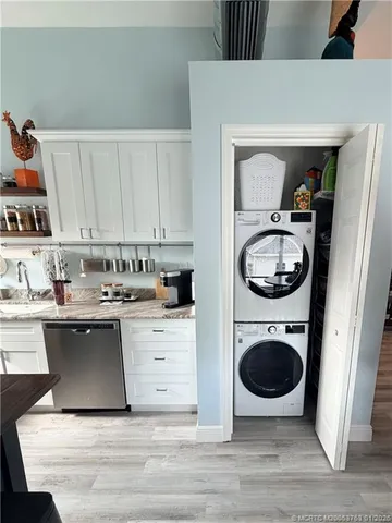 a kitchen with a stove a sink and a refrigerator