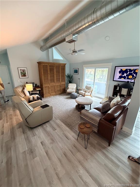 310 Southeast Denver Avenue, Unit 2 Stuart, FL 34994 - Photo 7 of 8 a living room with furniture and a wooden floor