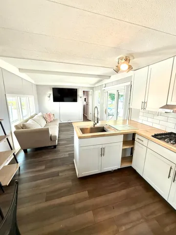 a room with a bed and a large window