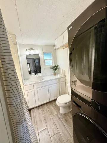 a bathroom with a sink a toilet and bathtub