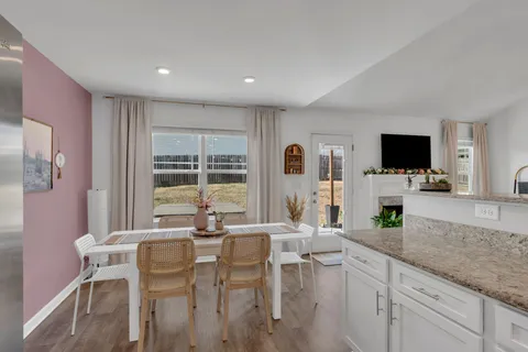 a kitchen with a sink stove and refrigerator