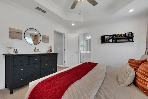 a bedroom with a bed and a cabinets