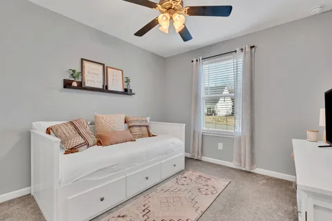 a room with a white bed and a couch