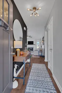 a very nice looking room with a mirror and a window