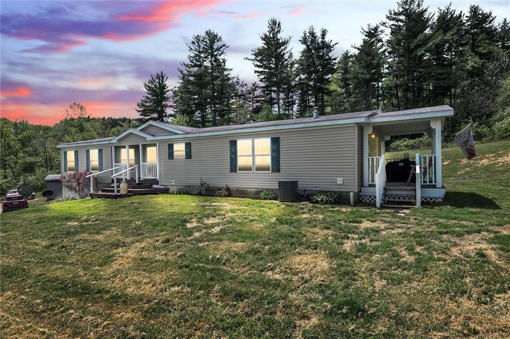 303 Wilhelm Road Rural Valley, PA 16249 - Photo 1 of 25 a house view with a garden space