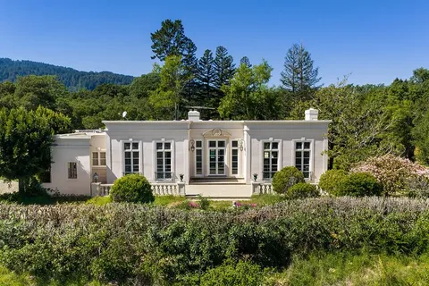 front view of a house with a garden