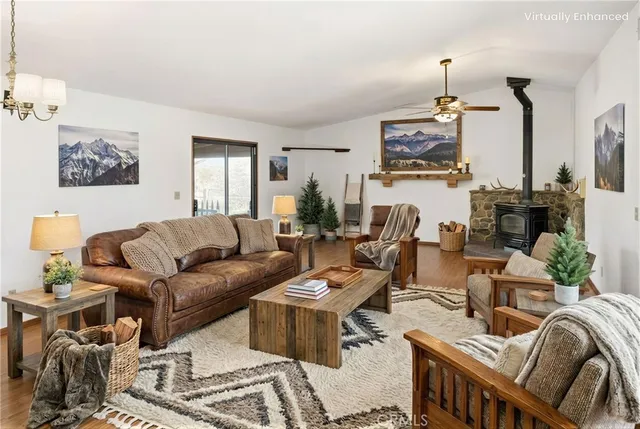 a large white kitchen with sink and stainless steel appliances