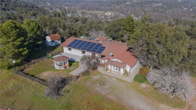 an aerial view of a house with a garden