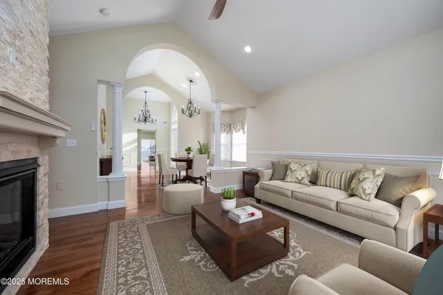 a large kitchen with cabinets wooden floor and stainless steel appliances
