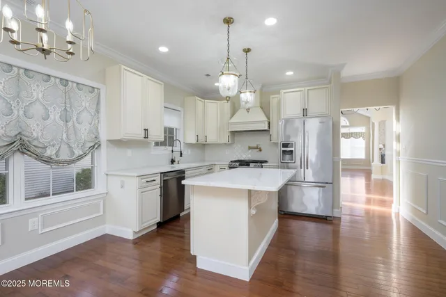 a view of kitchen with furniture and wooden floor