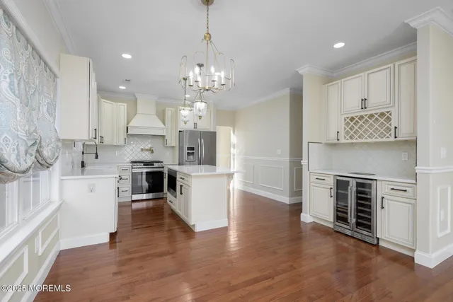 a view of kitchen with kitchen island and living room