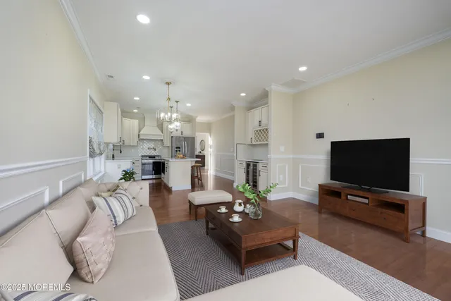 a view of a room with wooden floor