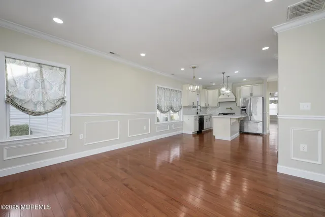a bathroom with a granite countertop sink mirror and shower