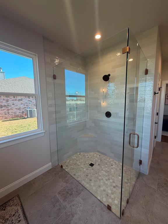 10401 T T Bury Lane Waco, TX 76708 - Photo 12 of 16 Bathroom featuring a stall shower and recessed lighting