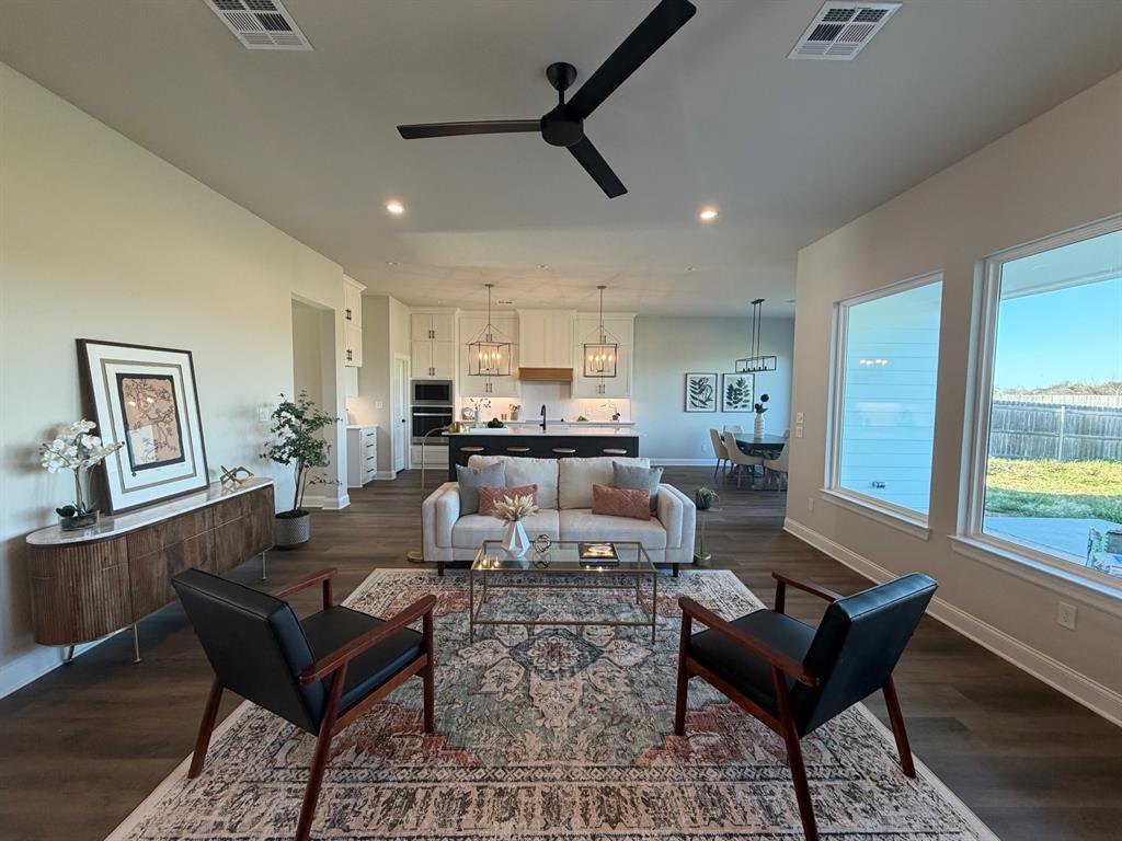 10401 T T Bury Lane Waco, TX 76708 - Photo 6 of 16 Living room featuring ceiling fan, dark wood-style floors, and recessed lighting