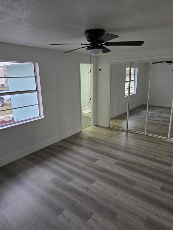 13737 Michelle Avenue Hudson, FL 34667 - Photo 14 of 25 a view of an empty room with a window