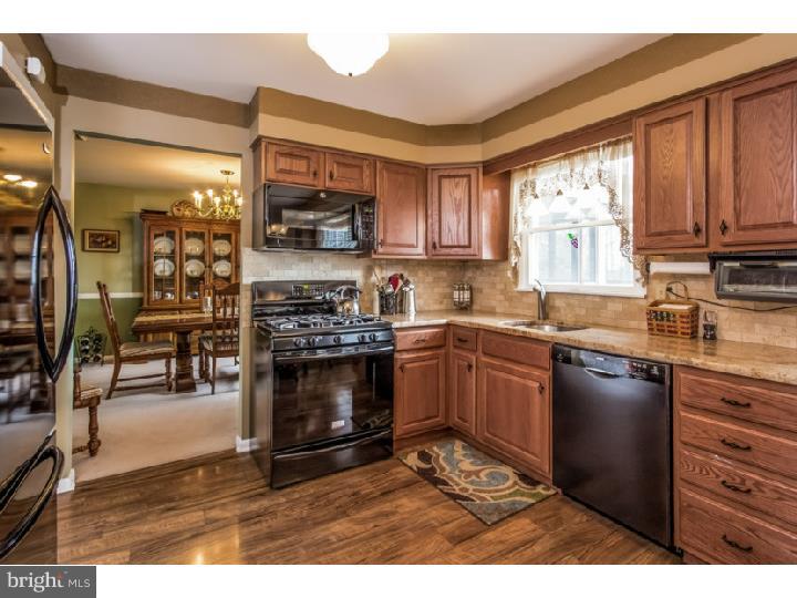 27274 Mt Pleasant Road Columbus, NJ 08022 - Photo 7 of 25 a kitchen with stainless steel appliances granite countertop a stove refrigerator sink and cabinets
