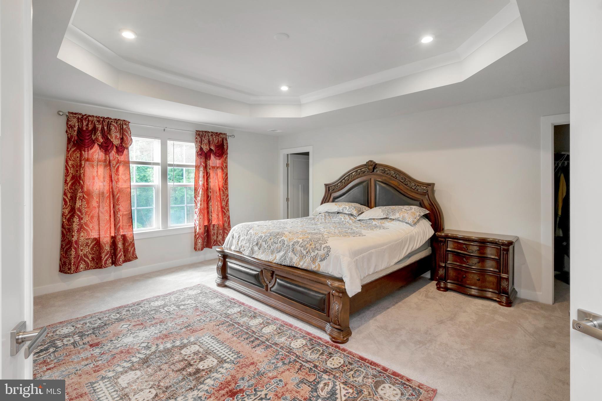 295 Potomac Run Road Fredericksburg, VA 22405 - Photo 12 of 33 a bedroom with a bed and large window