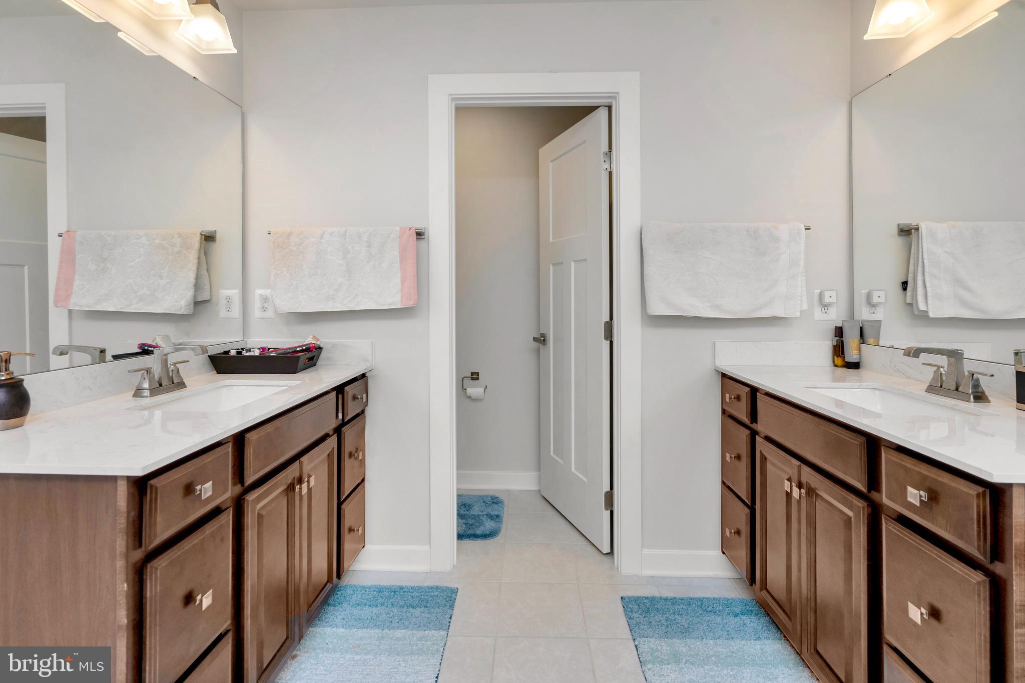 295 Potomac Run Road Fredericksburg, VA 22405 - Photo 14 of 33 a bathroom with a sink double vanity and a mirror