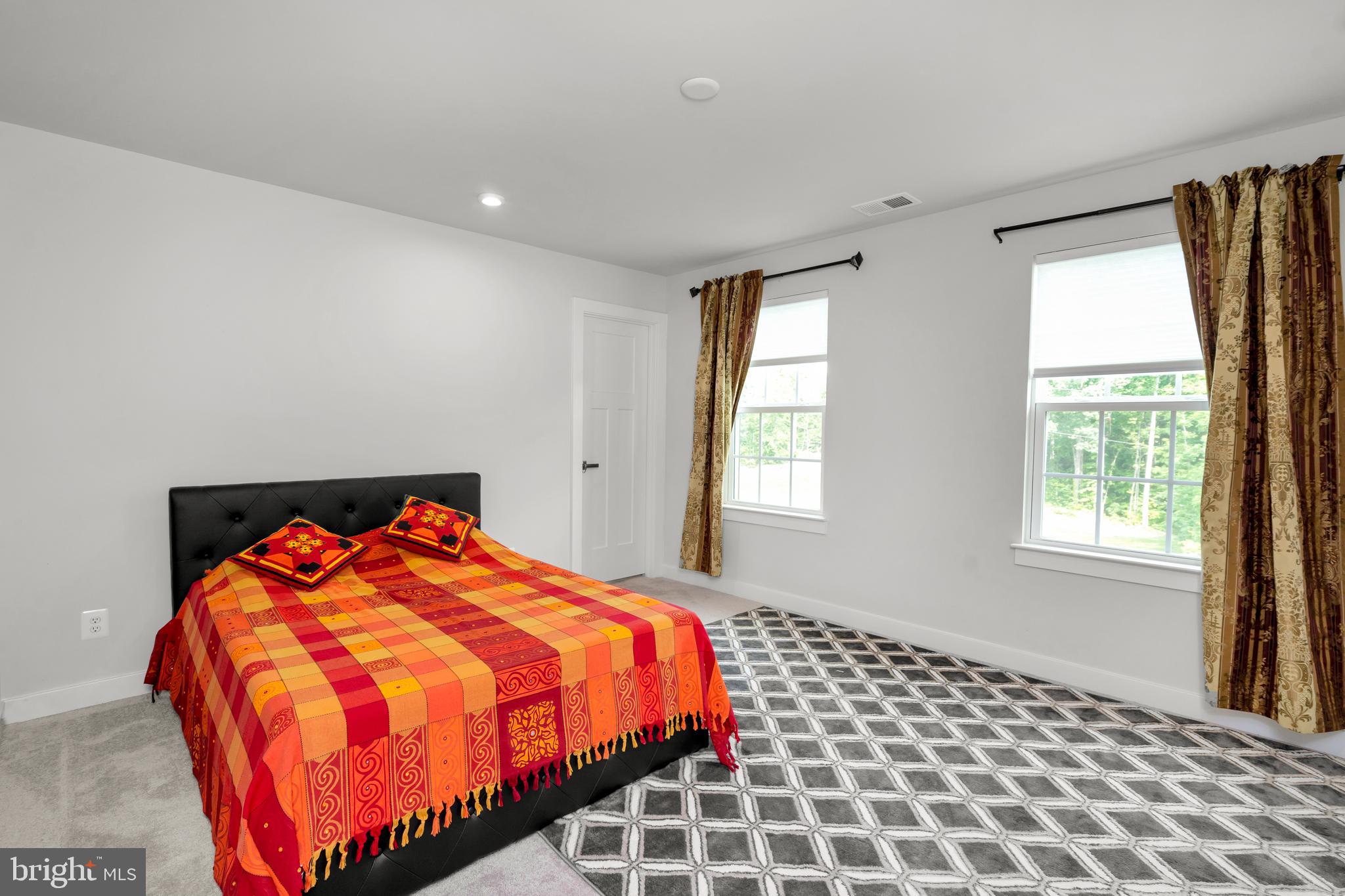 295 Potomac Run Road Fredericksburg, VA 22405 - Photo 20 of 33 a bedroom with a bed and window