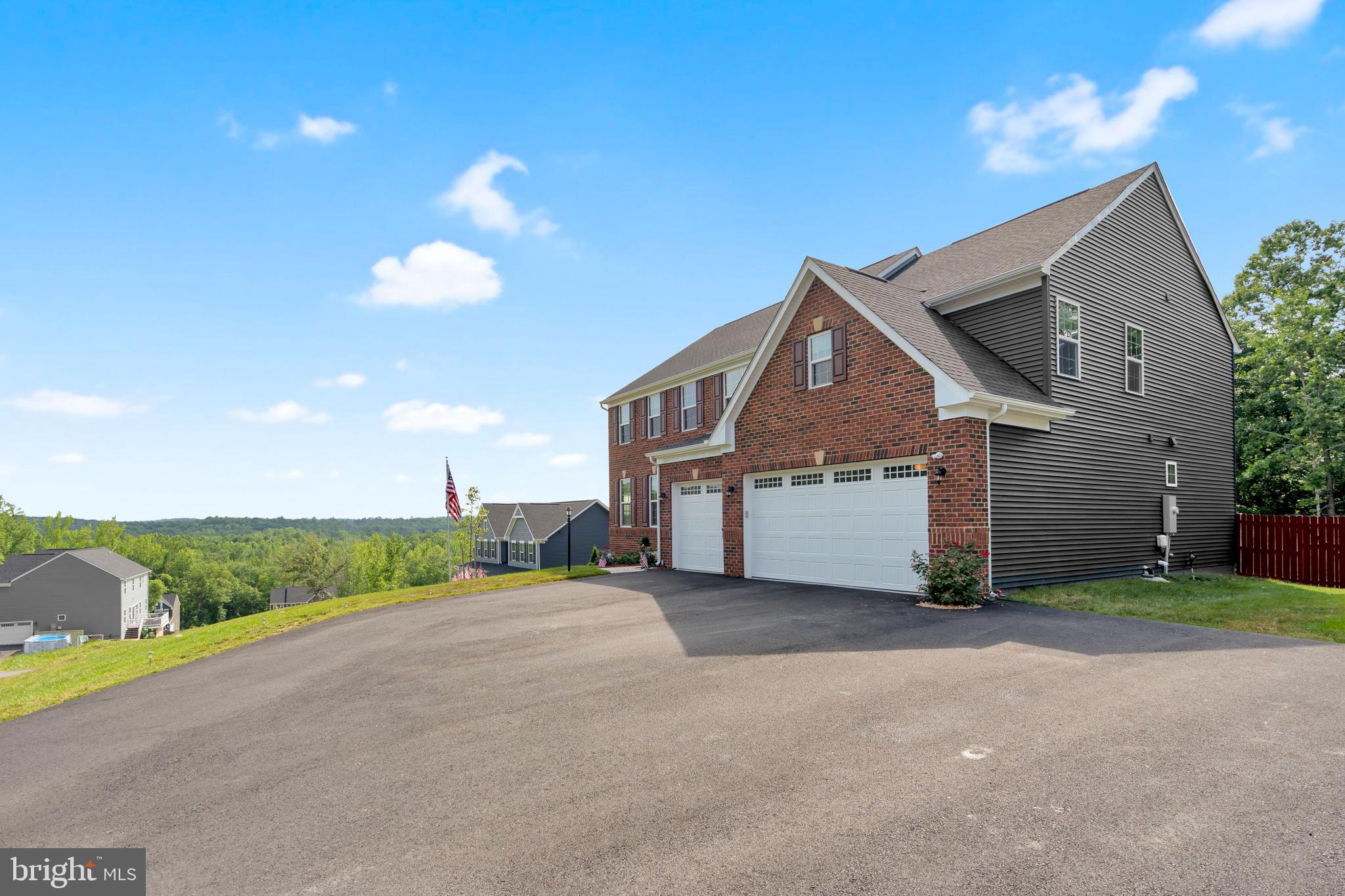 295 Potomac Run Road Fredericksburg, VA 22405 - Photo 2 of 33 a front view of a house with a yard and garage