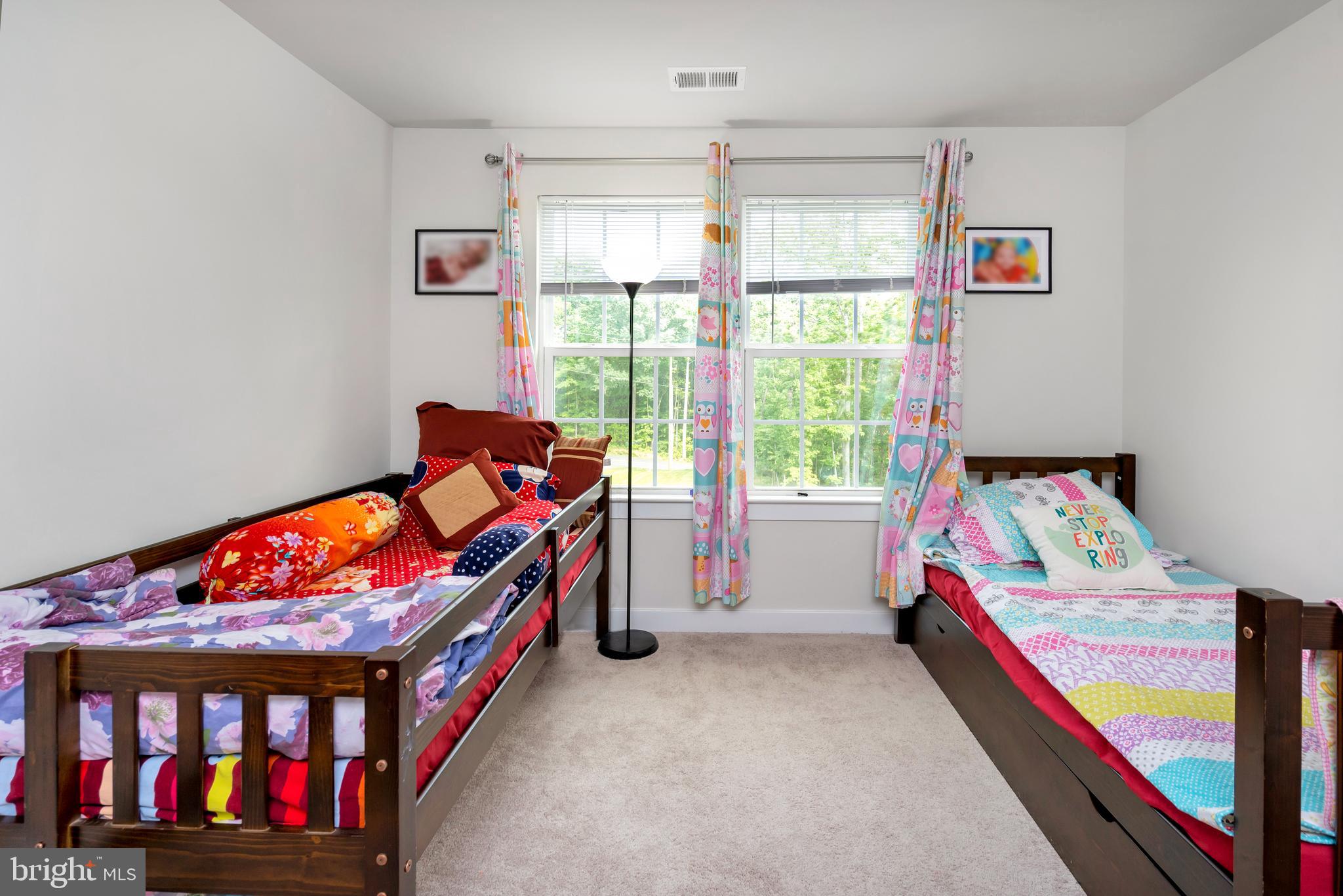 295 Potomac Run Road Fredericksburg, VA 22405 - Photo 22 of 33 a bedroom with bed and a window