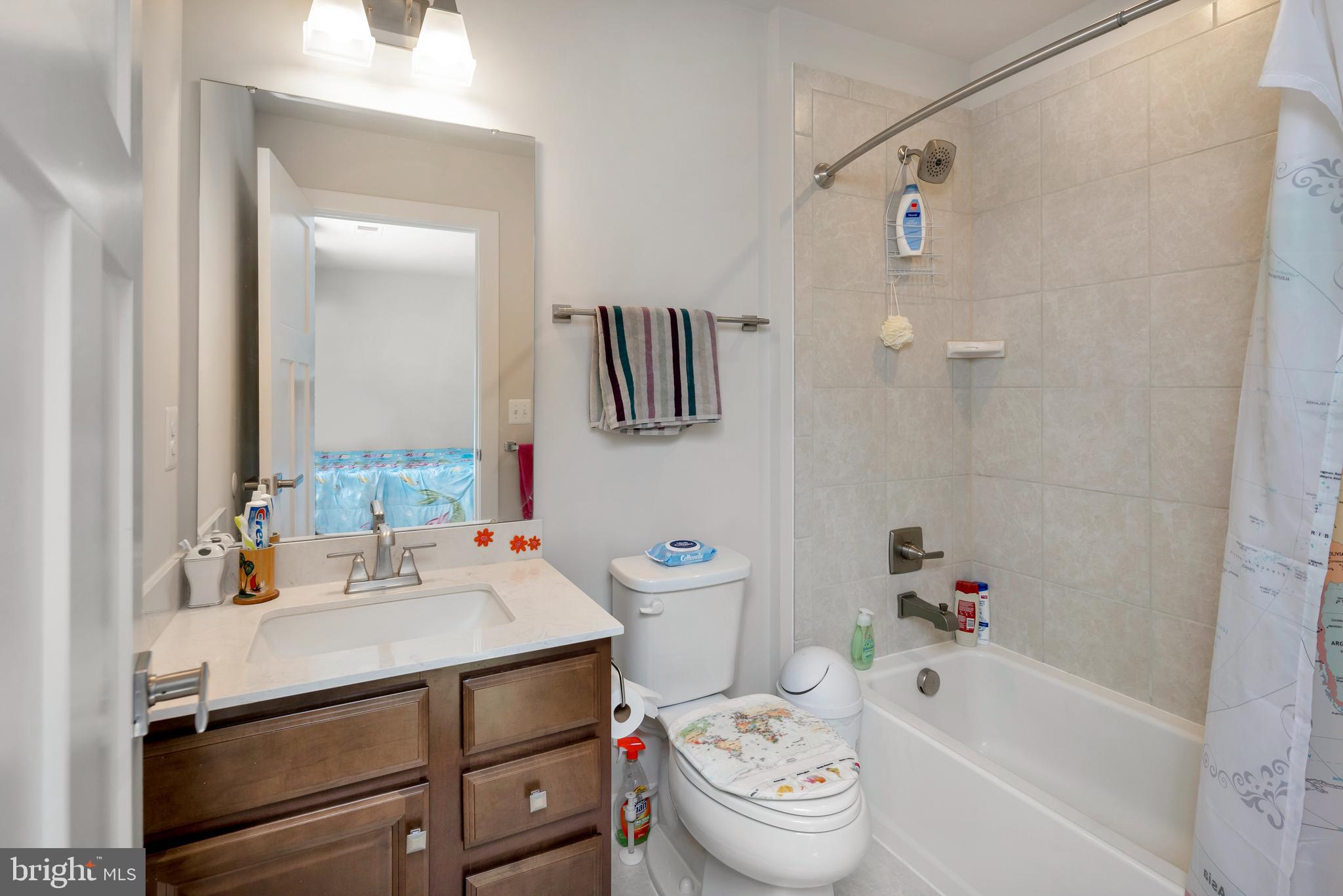 295 Potomac Run Road Fredericksburg, VA 22405 - Photo 23 of 33 a bathroom with a sink toilet and shower