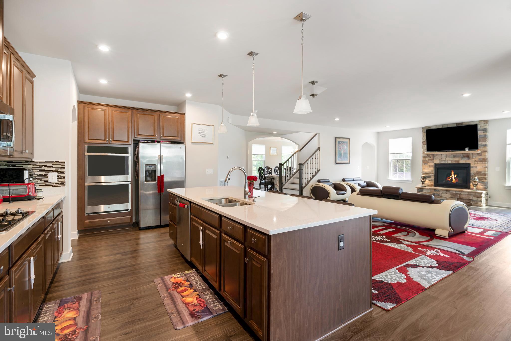 295 Potomac Run Road Fredericksburg, VA 22405 - Photo 3 of 33 a large kitchen with stainless steel appliances kitchen island granite countertop a sink and cabinets