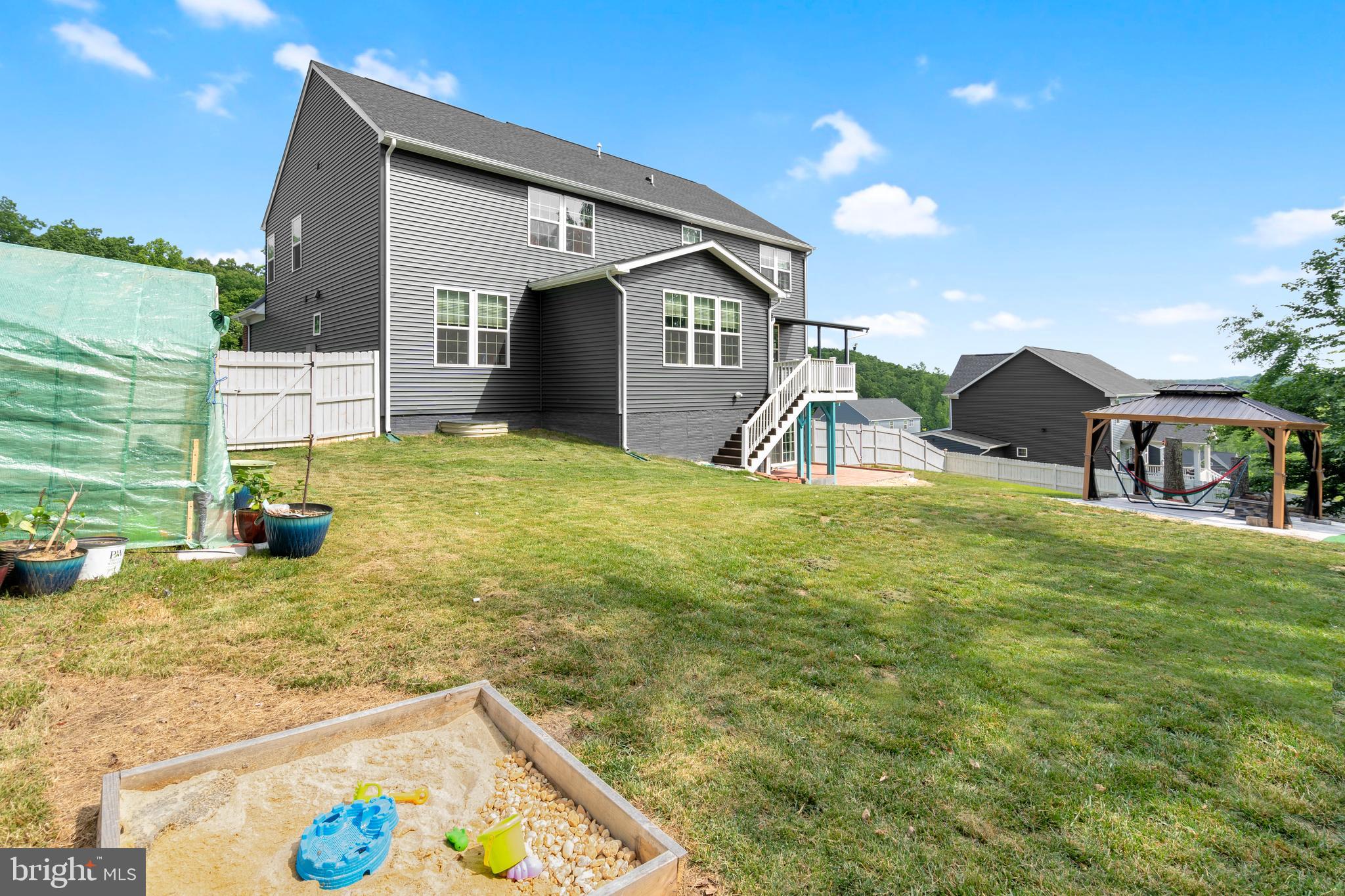 295 Potomac Run Road Fredericksburg, VA 22405 - Photo 31 of 33 a view of a house with swimming pool and a yard