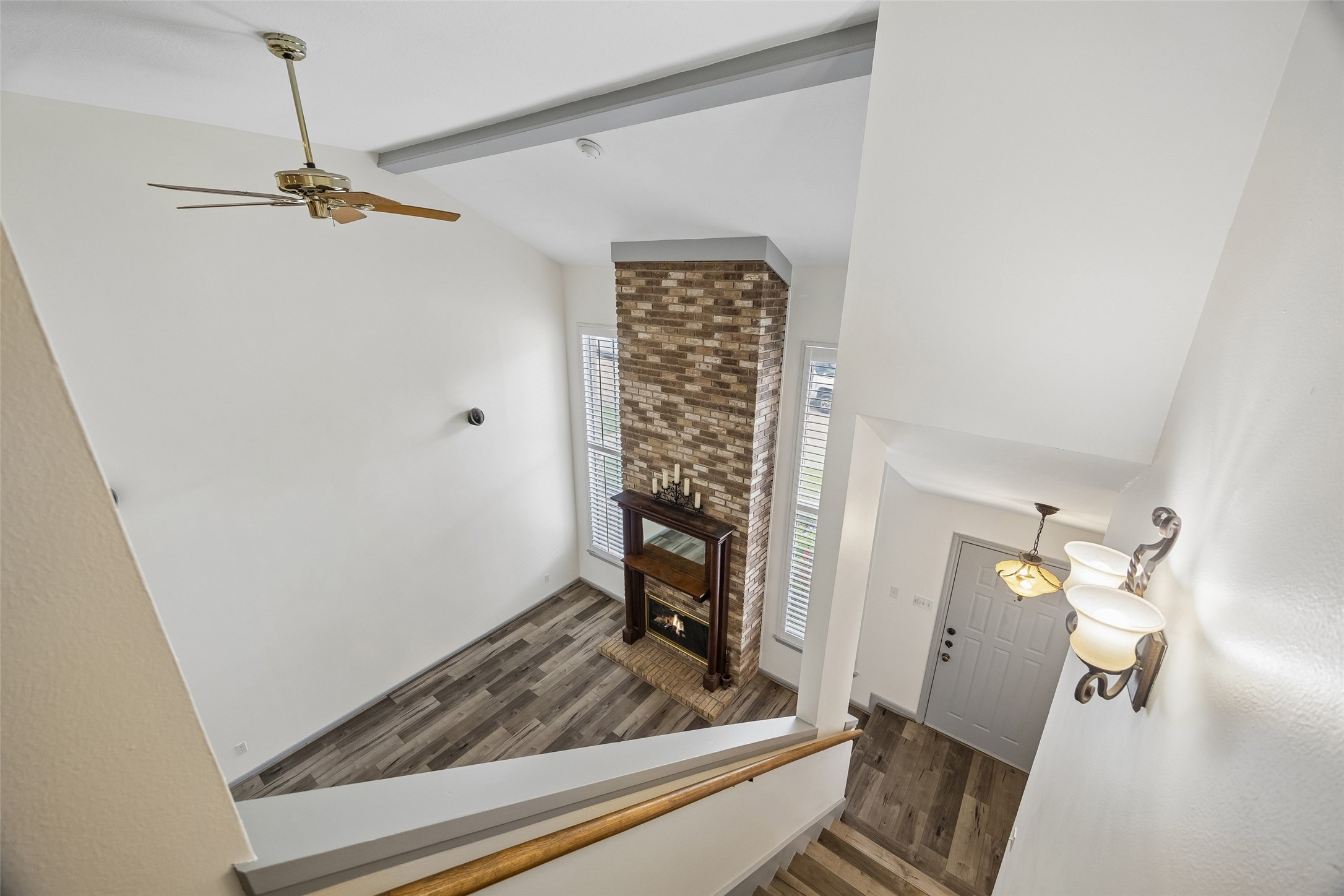 727 Bunker Hill Road, Unit 92 Houston, TX 77024 - Photo 21 of 50 LIVING ROOM TALL CEILING IS ENHANCED BY WOOD BEAM CREATING SUCH A DRAMATIC FEEL TO THIS LOVELY HOME.