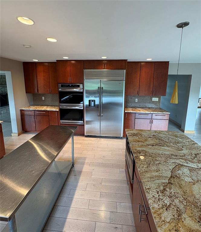 107 Revere Circle Indiana, PA 15701 - Photo 6 of 25 a kitchen with stainless steel appliances kitchen island granite countertop a refrigerator and a stove