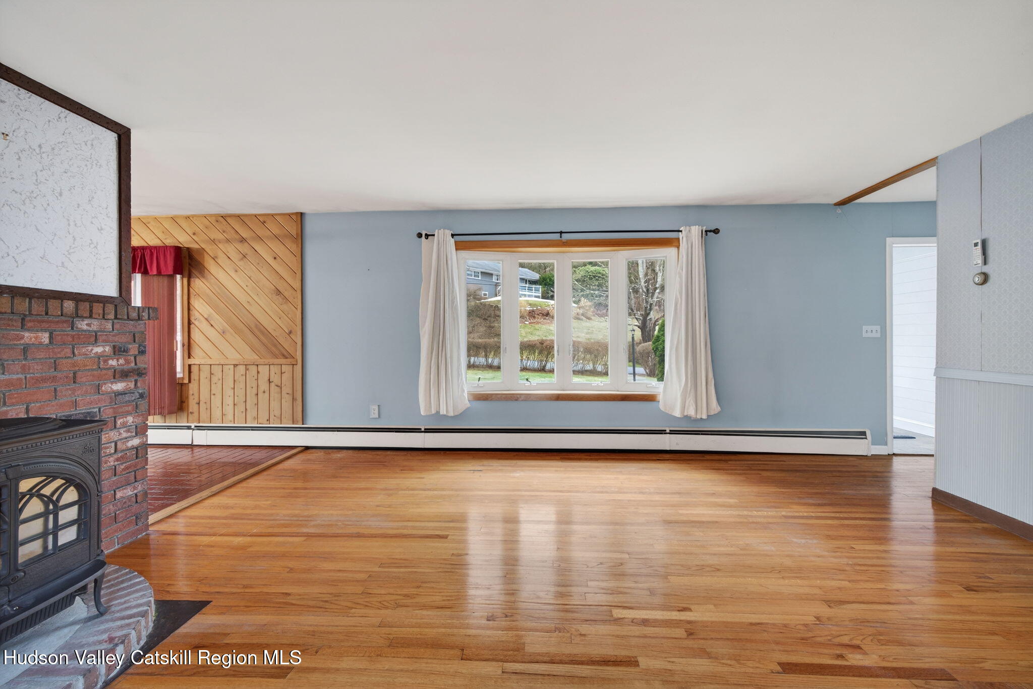 47 Meyers Road Kingston, NY 12401 - Photo 11 of 64 a view of an empty room with window and wooden floor