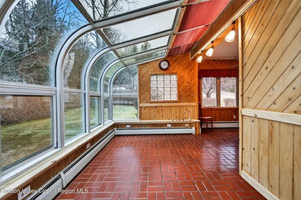an empty room with furniture and a fireplace