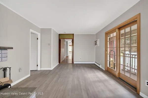 a view of an empty room with a window