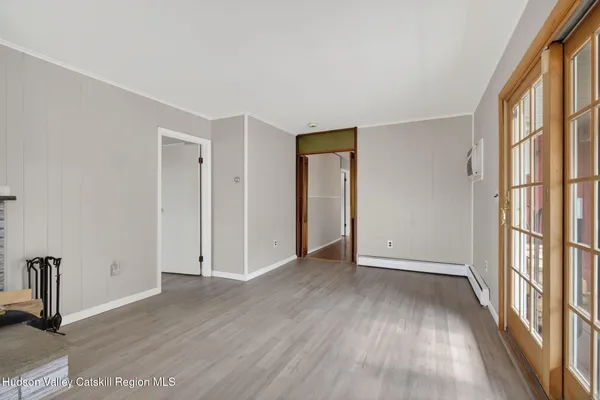 a view of an empty room with a window