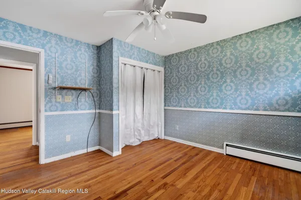 a view of a livingroom with wooden floor