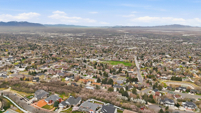 331 South 1550th Street East, Unit 3 Bountiful, UT 84010 - Photo 18 of 30 Aerial view of residential area featuring a mountain backdrop