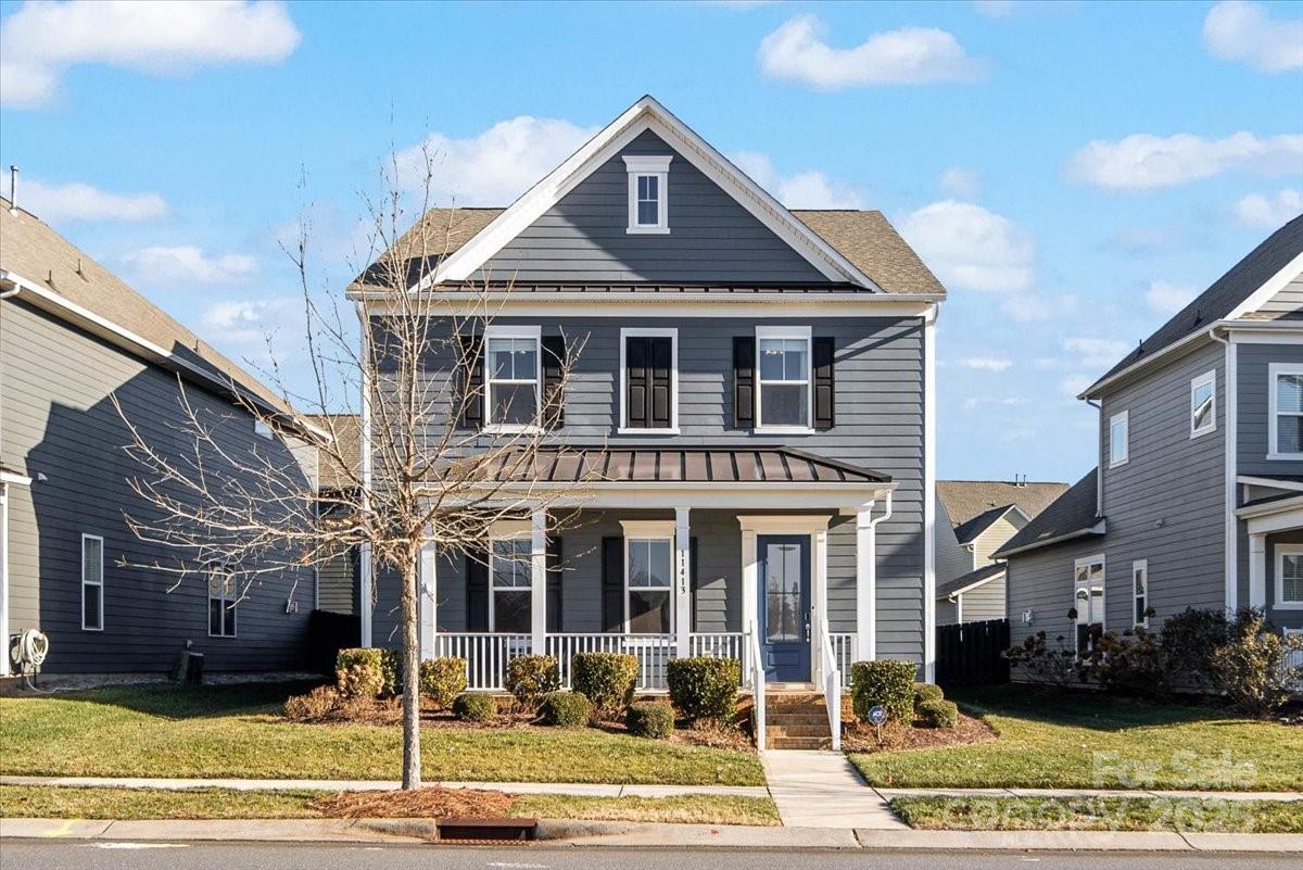 11413 Miller Road Pineville, NC 28134 - Photo 1 of 45 a front view of a house with a yard