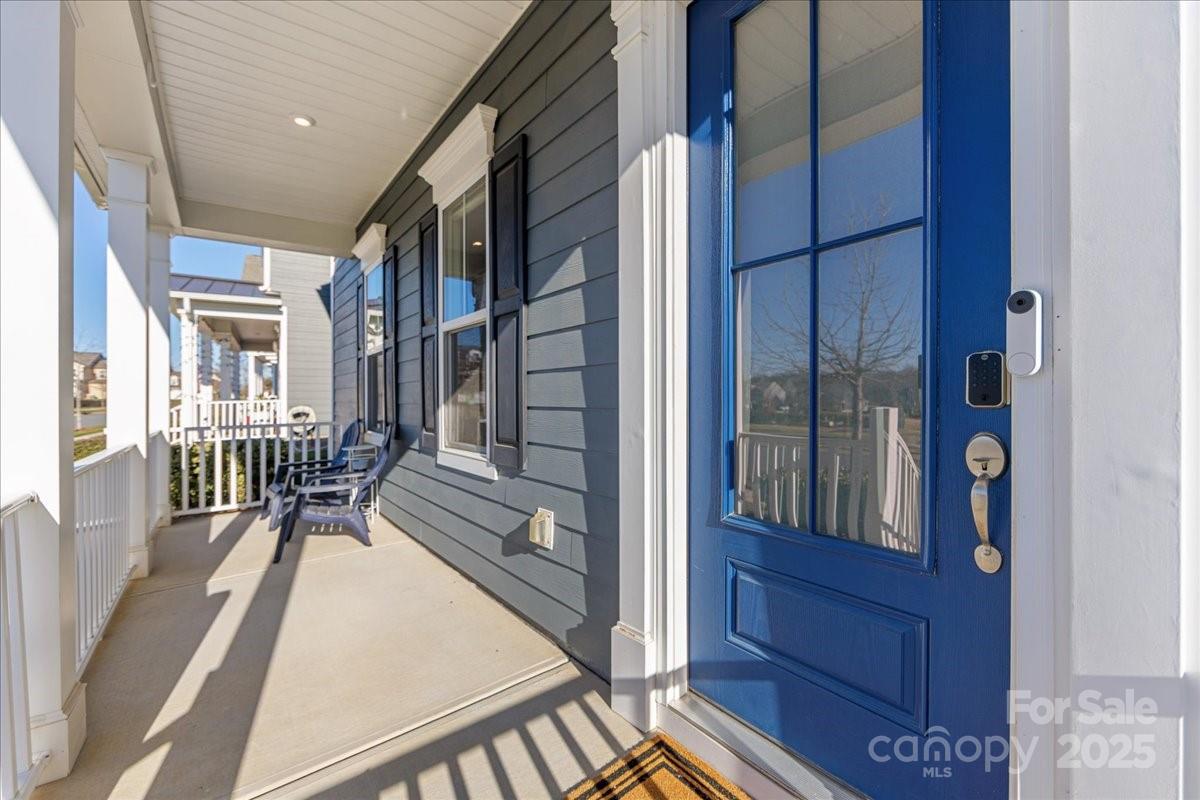11413 Miller Road Pineville, NC 28134 - Photo 2 of 45 a view of balcony and dining room with wooden floor