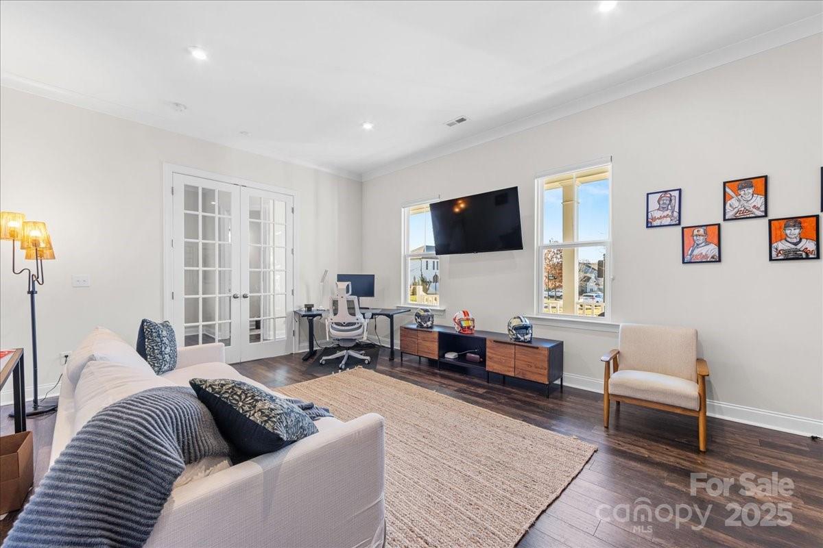 11413 Miller Road Pineville, NC 28134 - Photo 22 of 45 a living room with furniture and a flat screen tv