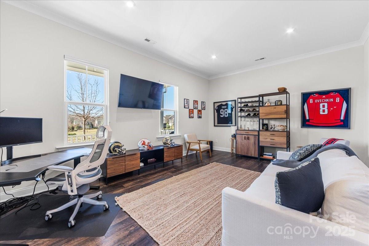 11413 Miller Road Pineville, NC 28134 - Photo 23 of 45 a living room with furniture and a flat screen tv