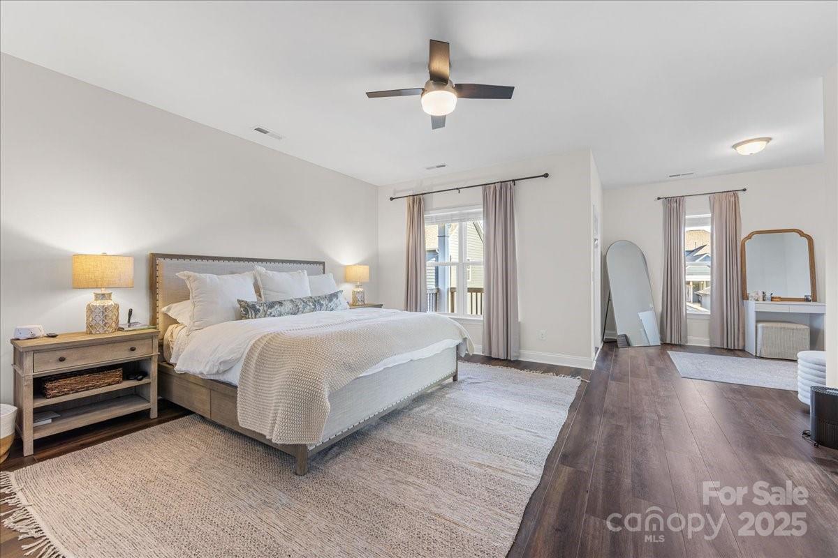 11413 Miller Road Pineville, NC 28134 - Photo 26 of 45 a bedroom with a bed and a chandelier