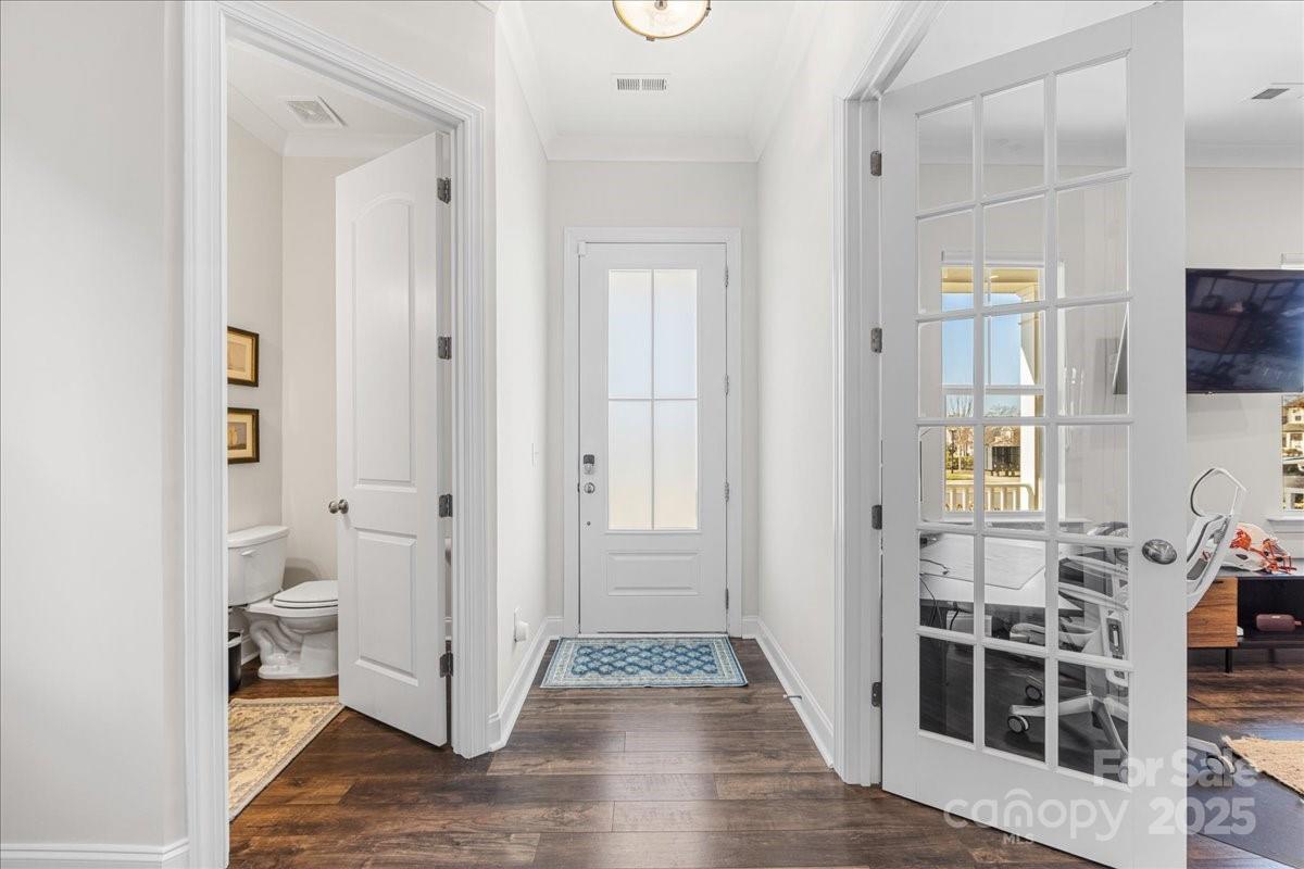 11413 Miller Road Pineville, NC 28134 - Photo 3 of 45 a view of a hallway with wooden floor and bathroom