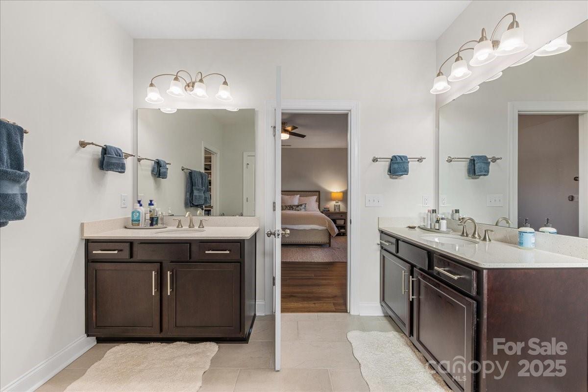 11413 Miller Road Pineville, NC 28134 - Photo 32 of 45 a spacious bathroom with a sink double vanity and a mirror