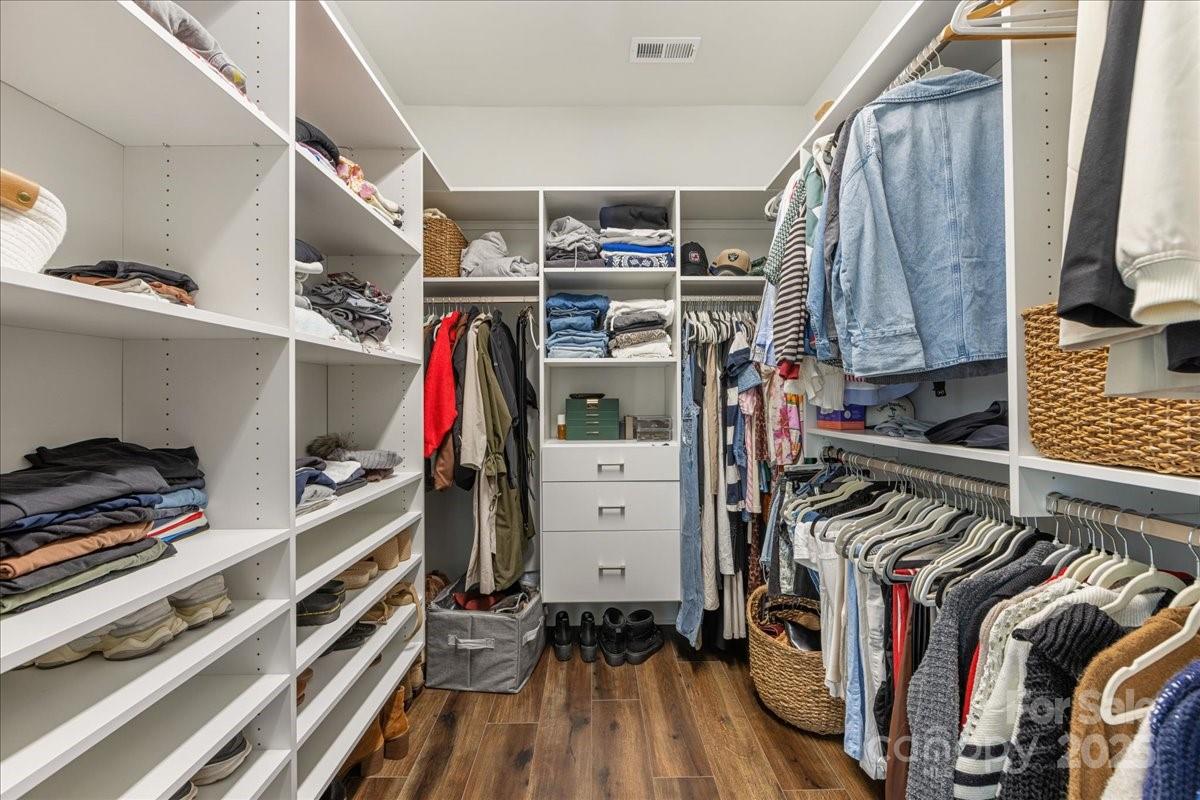 11413 Miller Road Pineville, NC 28134 - Photo 34 of 45 a view of walk in closet with clothes and shoes