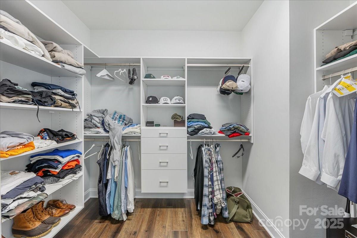 11413 Miller Road Pineville, NC 28134 - Photo 35 of 45 a view of walk in closet with clothes and shoes