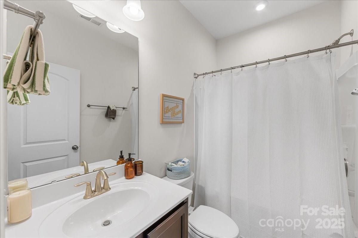 11413 Miller Road Pineville, NC 28134 - Photo 39 of 45 a bathroom with a sink toilet and shower