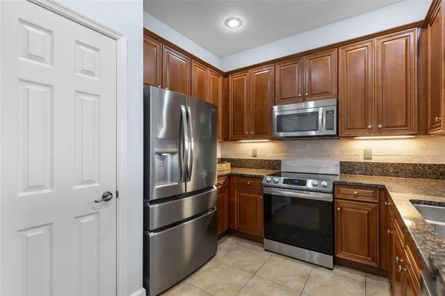 a bedroom with bed and a chandelier