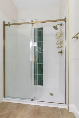 a view of storage and utility room with washer and dryer